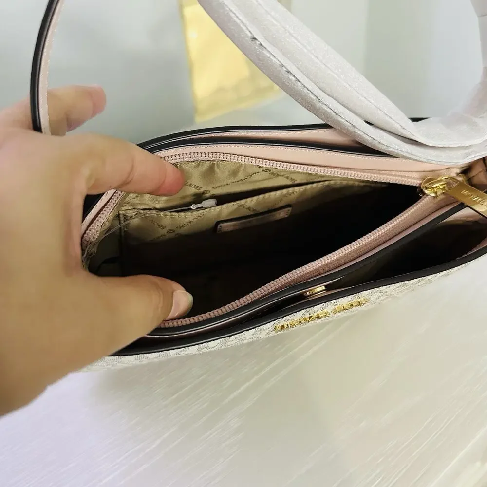 Michael Kors Trisha Medium Logo Crossbody Bag in a vanilla/light cream and pink